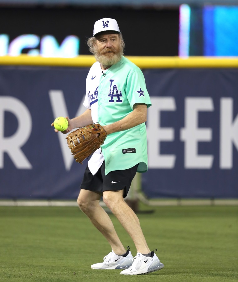 Joel McHale and Bad Bunny look on during the MGM All-Star Celebrity News  Photo - Getty Images