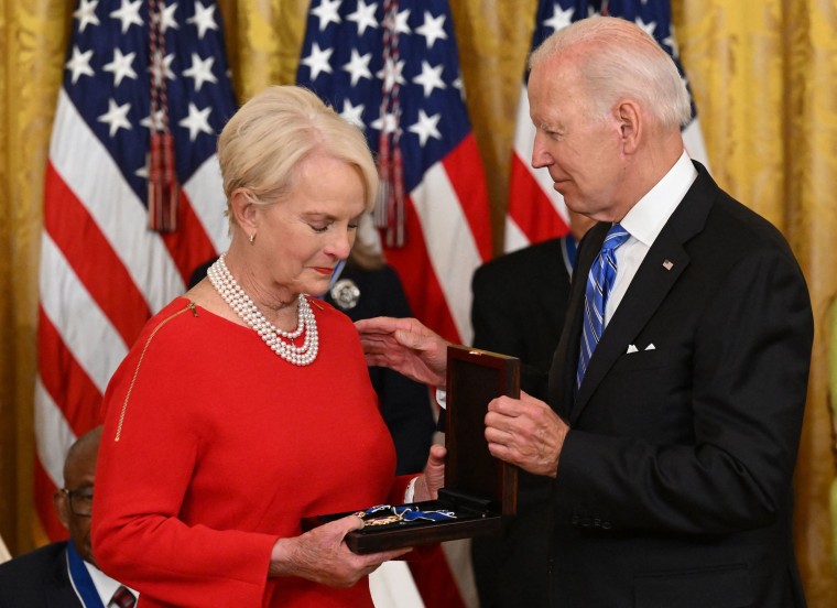 Biden presents Cindy McCain, the widow of former Senator and presidential candidate John McCain, posthumously with the Presidential Medal of Freedom.