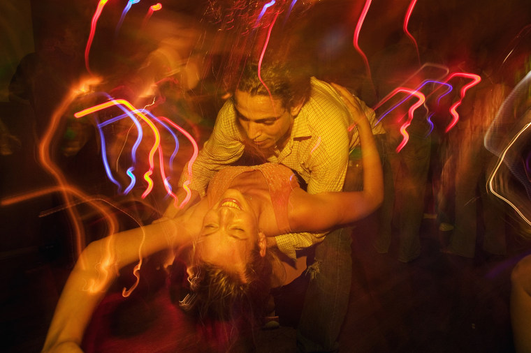 Couple dancing together in nightclub