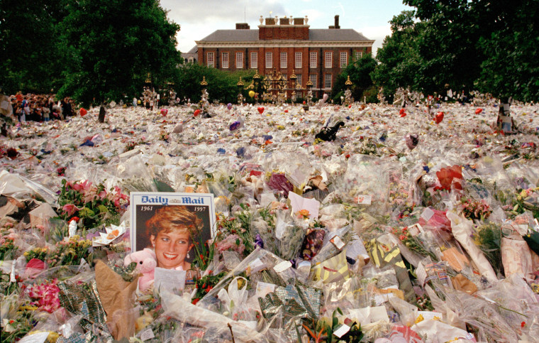 Flowers and mourners outside Kensington Palace in the days following the funeral of Princess Diana, in London, England, September 1997.