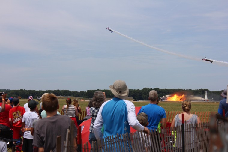 Airplanes continue over the explosion of Chris Darnell's truck.