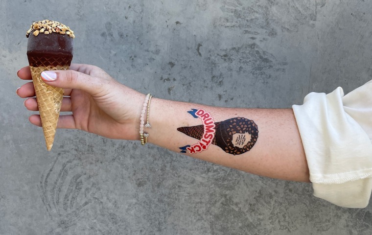 Arm with temporary bat tattoo.