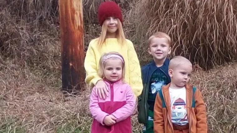 The four children stand together in a photo their cousin shared on Facebook.
