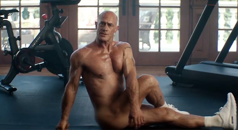 Chris Meloni getting his stretch on in the Peloton video.