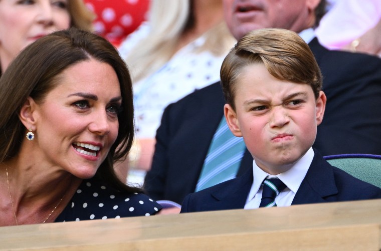 The former Kate Middleton talks to her eldest son as they watch the game.