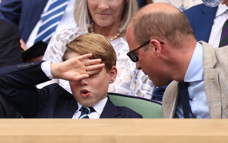 It's unclear whether Prince George was warding off the sun, his dad, or both.