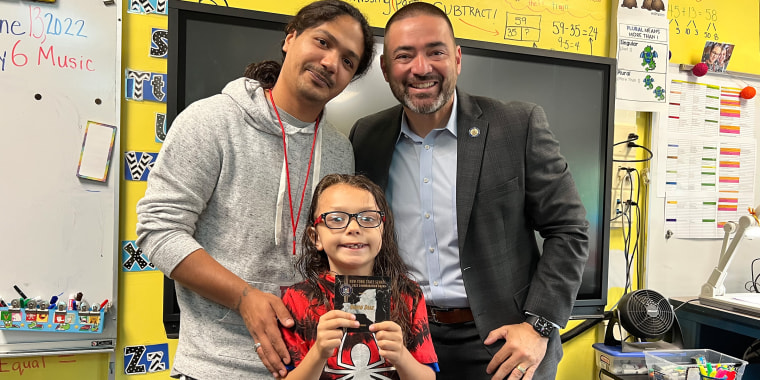 David Diaz Jr., center, received the New York State Senate Commendation Award for saving a choking classmate. He is pictured with his father, David Diaz Sr., left, and New York State Sen. Fred Akshar, right.