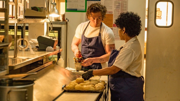 Carmy (Jeremy Allen White) and Tina (Liza Colón-Zayas) work alongside each other in the Hulu series where knives are sharp and stakes are high.