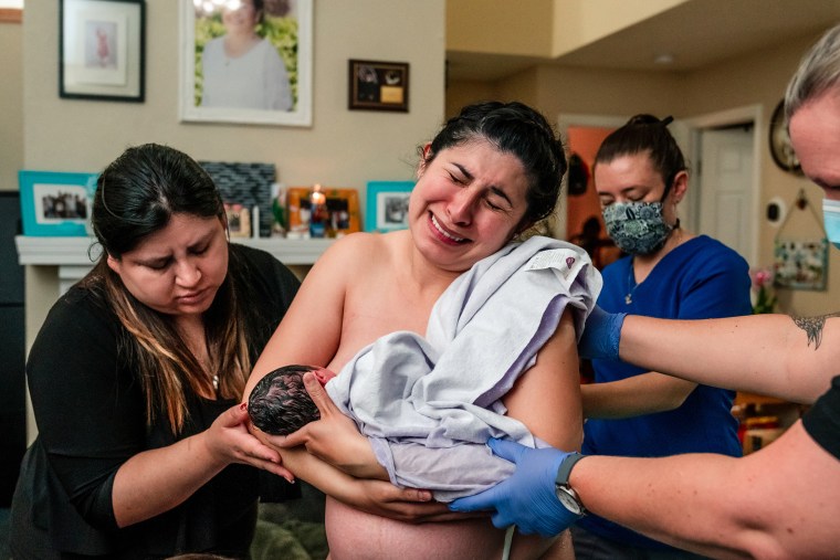 Ana Martinez nursed her baby while delivering her placenta.