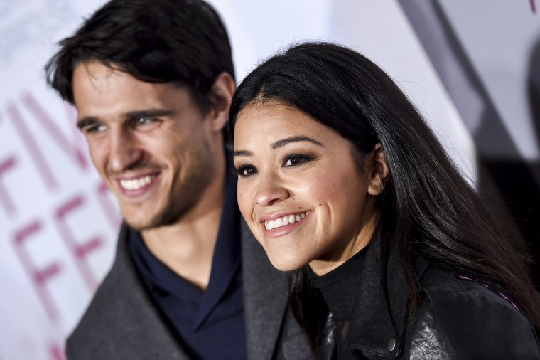 Image: Gina Rodriguez and Joe Locicero attend the premiere of 'Five Feet Apart' on March 7, 2019 in Los Angeles, Calif.