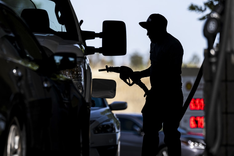Image: A customer fills up their gas tank at a gas station on June 22, 2022 in Hercules, Calif.