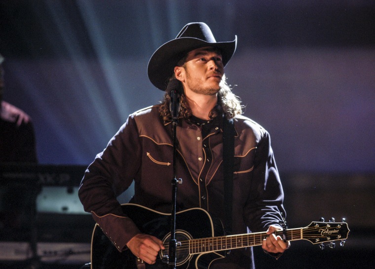 Image: Blake Shelton performs at the 37th Annual CMA Awards in 2003.