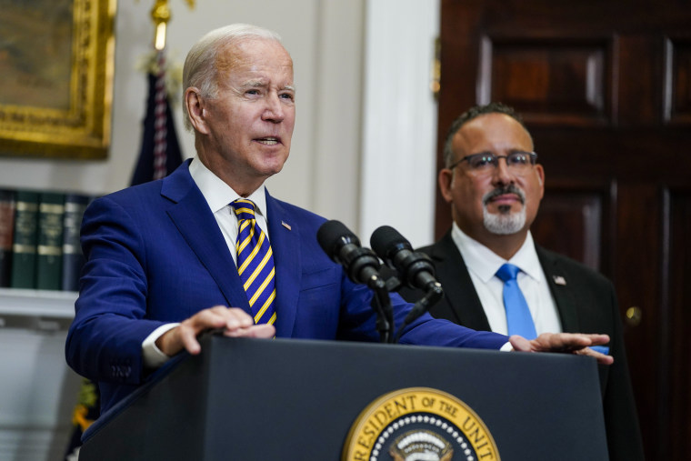 Image: President Joe Biden and Education Secretary Miguel Cardona address the press about  student loan debt forgiveness in the White House, on August 24, 2022, in Washington.