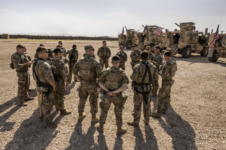 Image: U.S. Army soldiers prepare to go out on patrol from a remote combat outpost on May 25, 2021 in northeastern Syria.