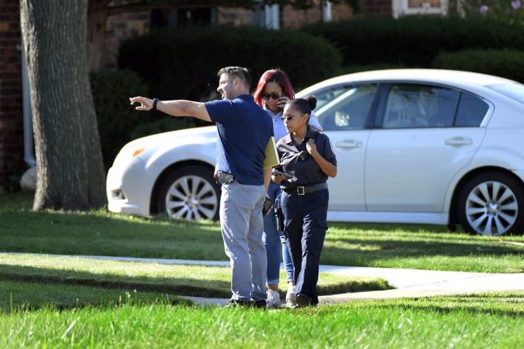 Image: Detroit Police and investigators look over a shooting scene on Pennington Drive, north of Seven Mile Road, Aug. 28, 2022, in Detroit.