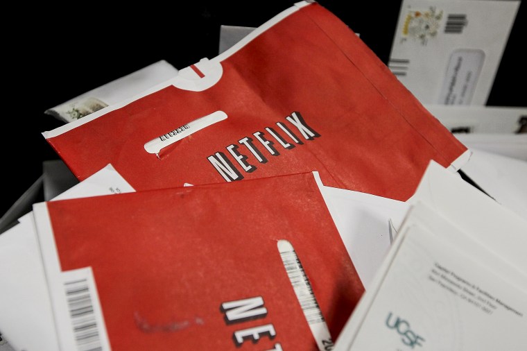 Image: Red Netflix envelopes sit in a bin of mail at the U.S. Post Office sort center on March 30, 2010 in San Francisco, Calif.