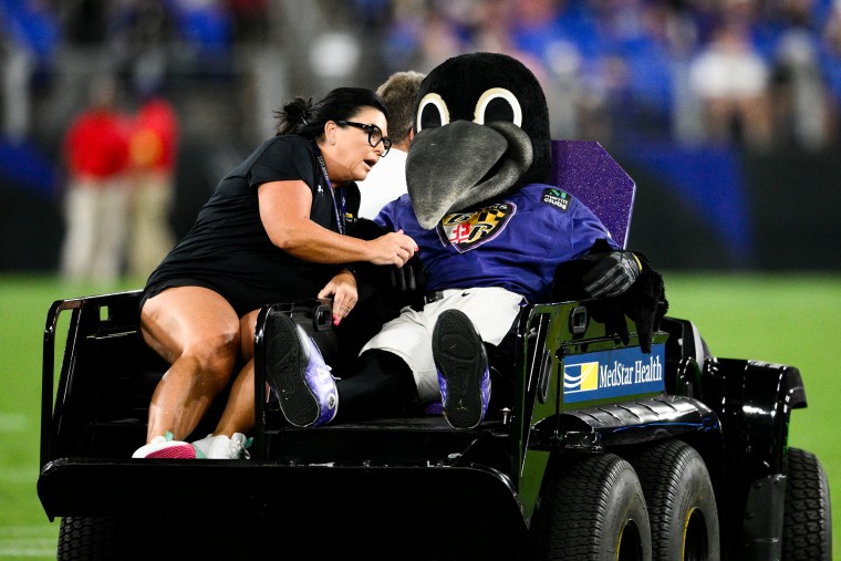 Poe, the Baltimore Raven's mascot is carted off the field after sustaining an injury during halftime on August 27, 2022.