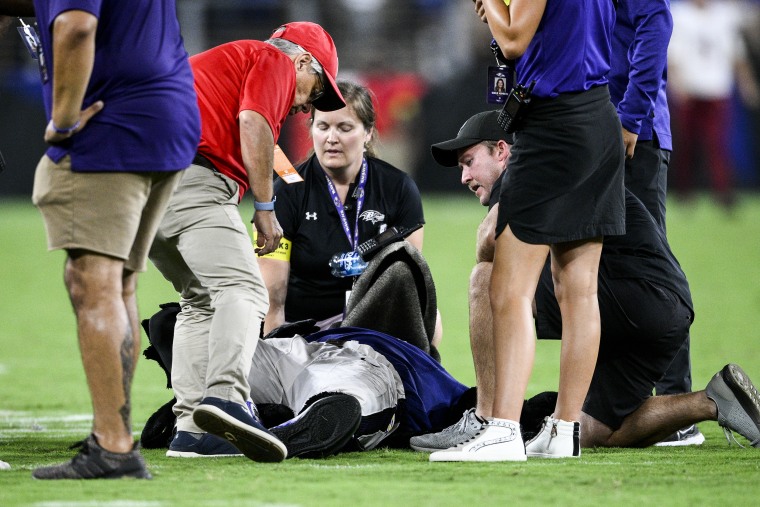 Image: Poe, the Baltimore Ravens' mascot, is tended to during halftime of a preseason NFL football game between the Ravens and the Washington Commanders on Aug. 27, 2022, in Baltimore.
