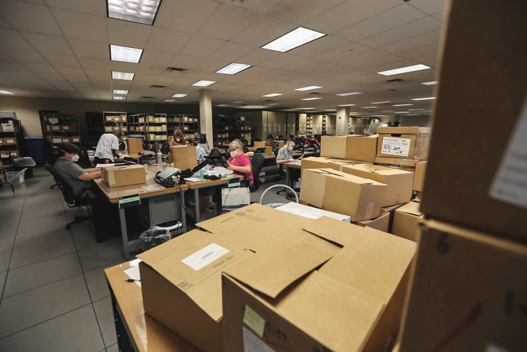 Employees and contracted staff toil through gun records at the ATF’s National Tracing Center, located in Martinsburg, W.Va.