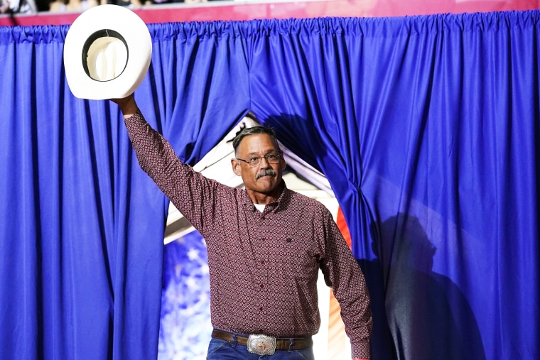 Mark Finchem, a Republican candidate for Arizona Secretary of State, waves to the crowd at a rally  on July 22, 2022, in Prescott.