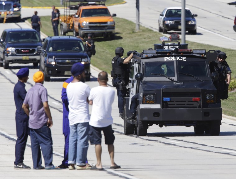 Police outside the Sikh temple in Oak Creek, Wis., after the shooting Aug 5, 2012. 