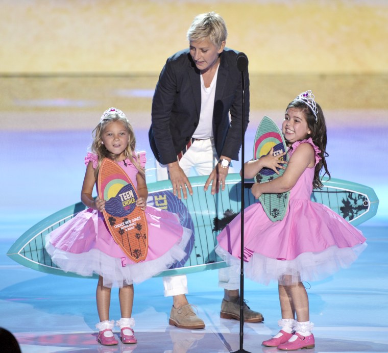 Image: Ellen DeGeneres, center, accepts the award for choice comedian onstage with Rosie Mcclelland, left, and Sophia Grace Brownlee at the Teen Choice Awards on  July 22, 2012, in Universal City, Calif.