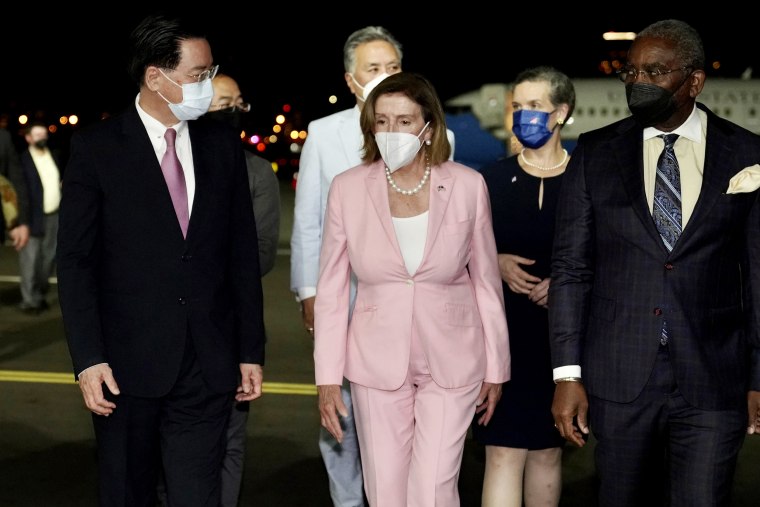 House Speaker Nancy Pelosi arrives in Taiwan as she is welcomed by Taiwan Foreign Minister Joseph Wu, left, at Taipei Songshan International Airport on Aug. 2.
