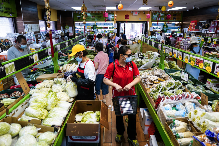 Image: Customers shop for produce in the Chinatown neighborhood of Philadelphia on July 22, 2022.
