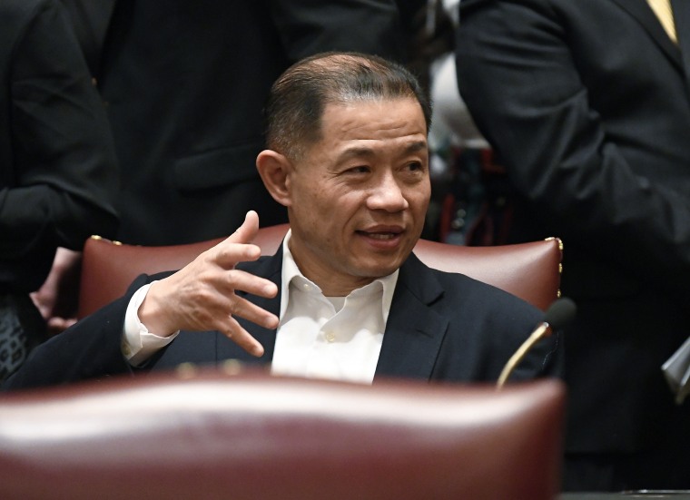 Sen. John Liu, D-Queens, talks to Senate members at the Capitol in Albany, N.Y., in 2019.
