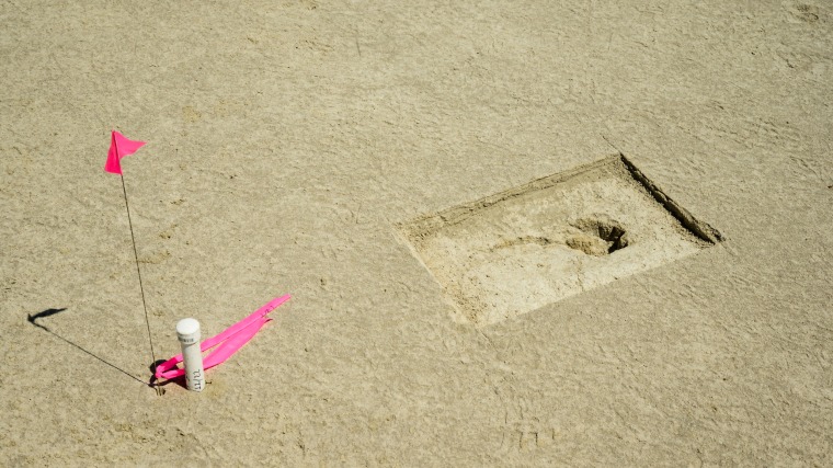 A footprint discovered on an archaeological site is marked with a pin flag on the Utah Test and Training Range on July 18, 2022.