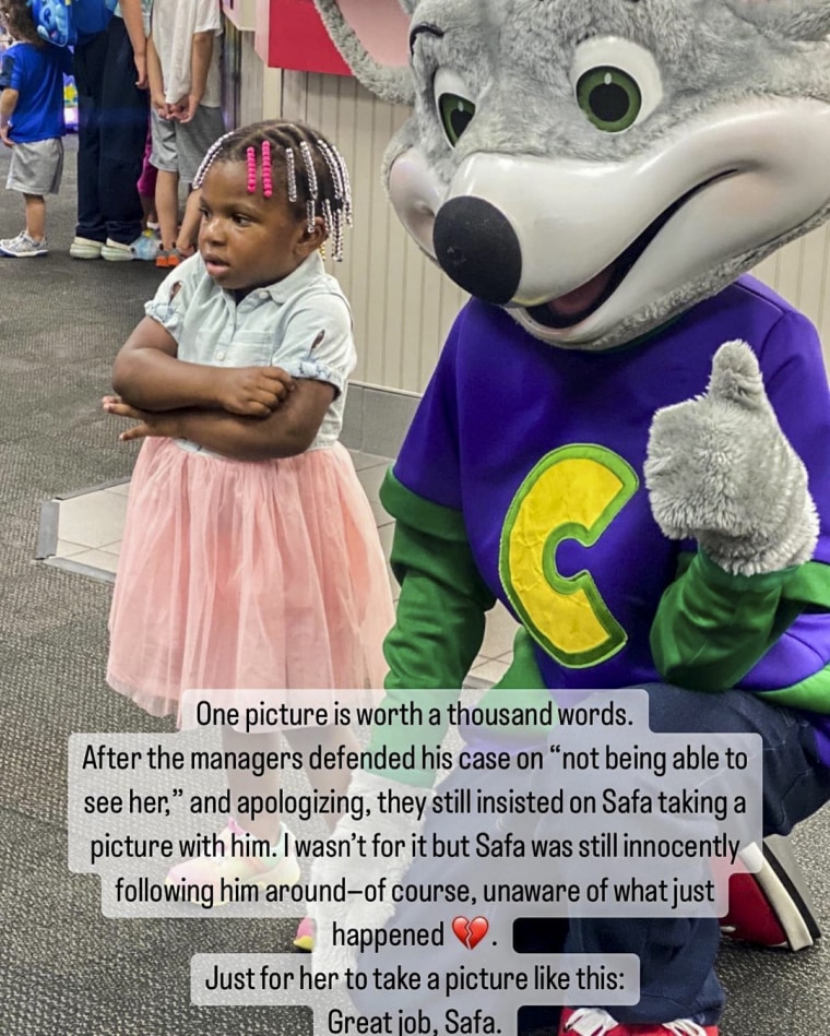 Image: Safa, the toddler in the viral video, with the Chuck E. Cheese mascot.