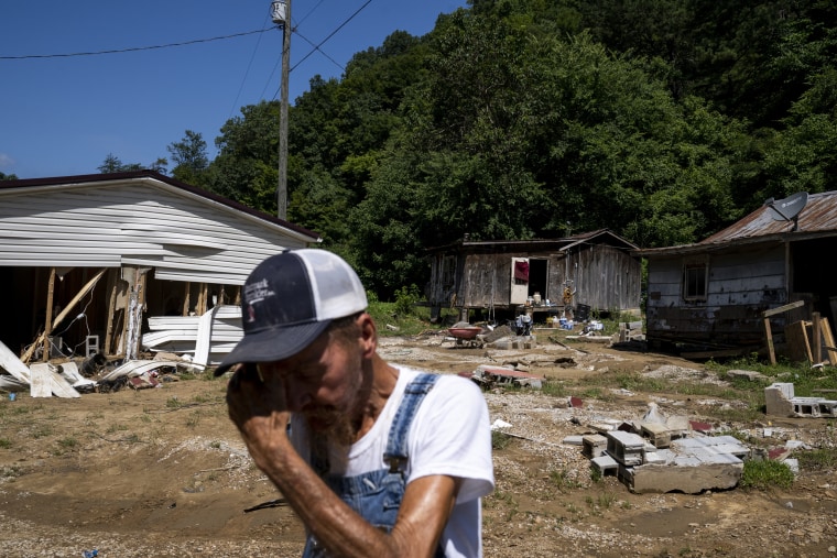 Image: Delbert White wipes sweat from his face in front of his home in Caney, Ky., on Aug. 3, 2022.