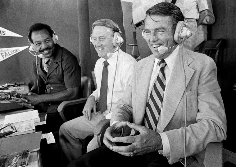 Image: Former Los Angeles Rams coach, George Allen, laughs with CBS sports broadcasters Jim Brown, left, and Vince Scully during his first day on the job as a CBS sportscaster in the Los Angeles Coliseum just prior to the Rams-Falcons game on Sept. 10, 1978.