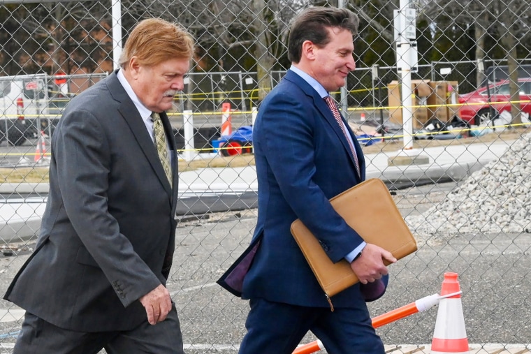 Image: Robert Fehring, left, arrives at federal court with his attorney in Central Islip, N.Y., on Feb. 23, 2022.