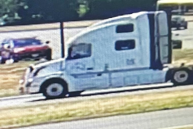 Police in New Jersey are searching for a white semi-truck after a bloodied woman was allegedly seen yelling from the big rig's cabin Wednesday.