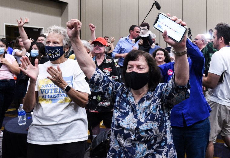 Abortion rights supporters cheer as the proposed constitutional amendment that would severely restrict abortion access fails at a primary night watch party in Overland Park, Kansas, on Aug. 2, 2022.