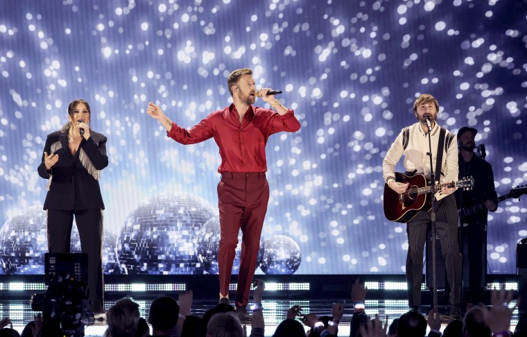 Image: Hillary Scott, Charles Kelley, and Dave Haywood of Lady A perform onstage during the 57th Academy of Country Music Awards on March 7, 2022 in Las Vegas.