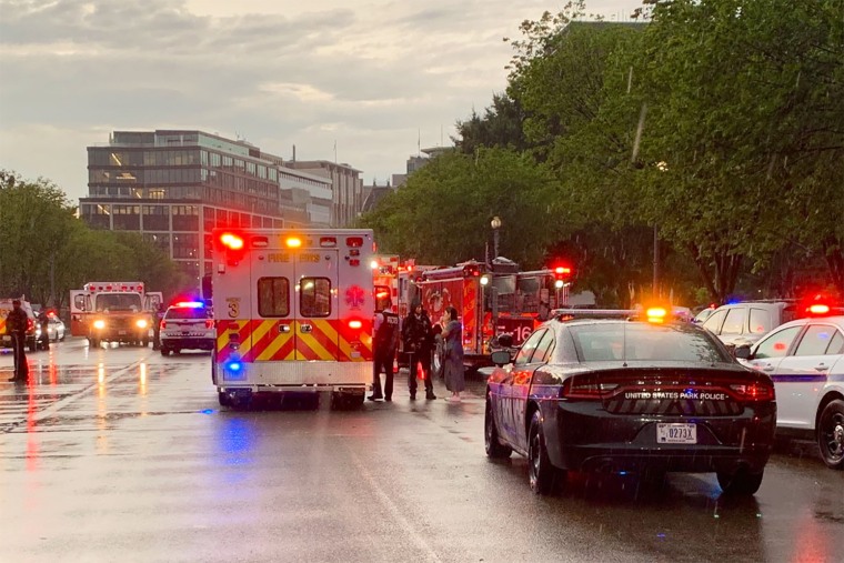 Emergency personnel respond to people injured after an apparent lightning strike at Lafayette Park in Washington, DC, on Aug. 4, 2022.