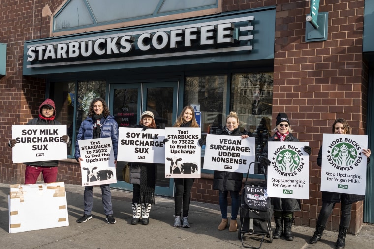 Animal rights activists protest the extra charge in plant-based milk outside a Starbucks in Union Square in New York City on Dec. 21, 2019.