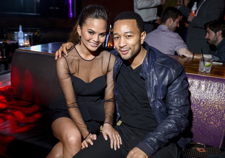 Image: Chrissy Teigen, wearing an engagement ring and John Legend on February 13, 2013 in Las Vegas, Nev.