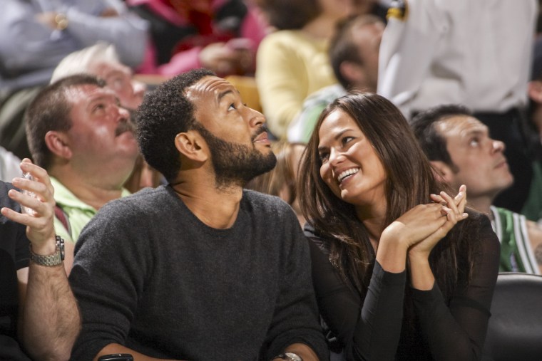 Image: John Legend with girlfriend and Sports Illustrated Swimsuit model Christine Teigen during a Boston Celtics vs Cleveland Cavaliers game on May 9, 2010 in Boston.