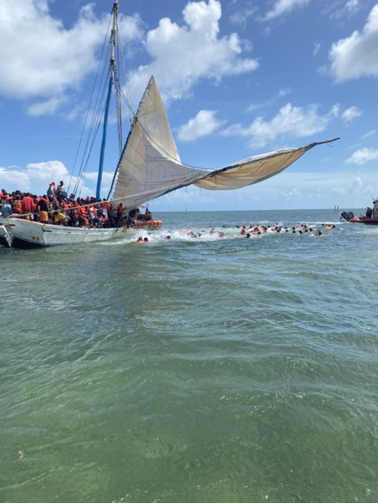 More than 300 Haitians were discovered on a wooden sailboat that was grounded near Key Largo on Saturday, officials said.