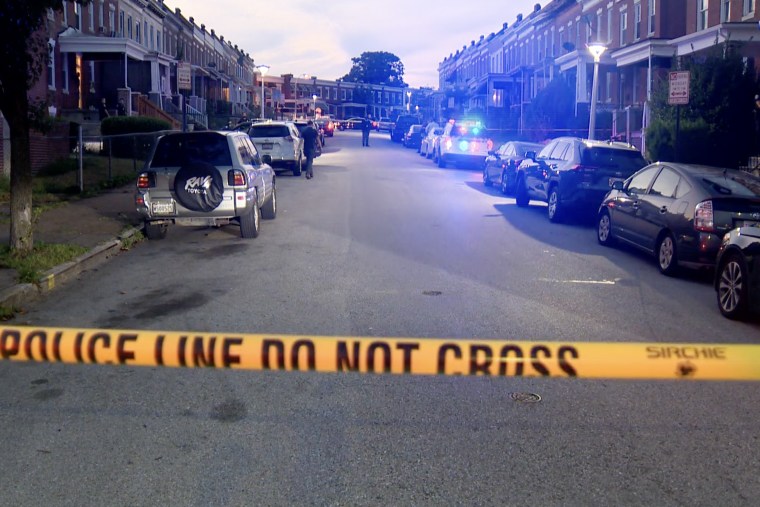 Police officers seal off the street where a 15 year old girl was accidentally fatally shot by a 9 year old boy playing with a loaded gun in Baltimore, Md., on Saturday Aug. 6, 2022/