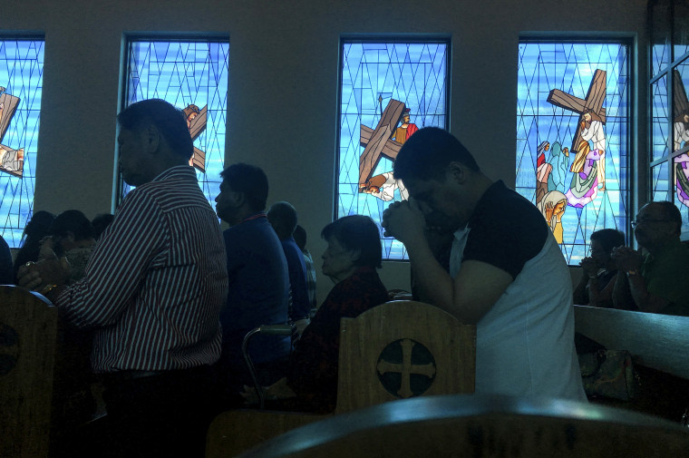 Worshippers attend Sunday Mass at Blessed Diego de San Vitores Church in Tumon, Guam, in 2017.