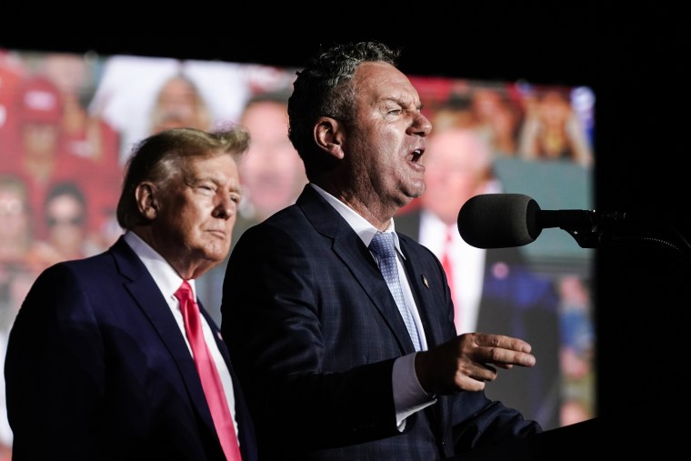 Wisconsin Republican gubernatorial candidate Tim Michels speaks alongside former President Donald Trump at a rally on Aug. 5, 2022, in Waukesha.