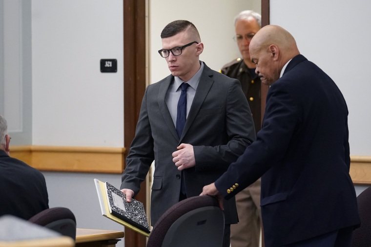 Image: Volodymyr Zhukovskyy, of West Springfield, Mass., center, charged with negligent homicide in the deaths of seven motorcycle club members in a 2019 crash, enters a courtroom at Coos County Superior Court, in Lancaster, N.H., on July 25, 2022.