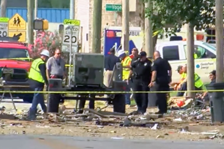 Emergency personnel investigate a house explosion in Evansville, Ind., on Aug. 10, 2022.