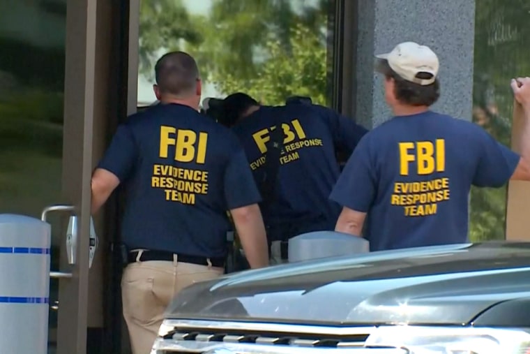 FBI Evidence Response Team gather evidence at the FBI building in Cincinnati on Thursday.