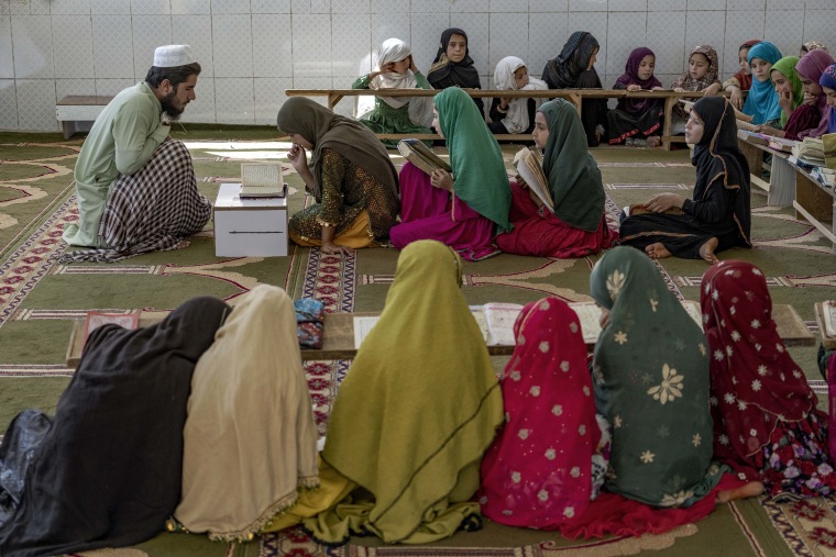 Qari Mirwais teaches girls to read the Quran in the Noor Mosque outside Kabul this month.
