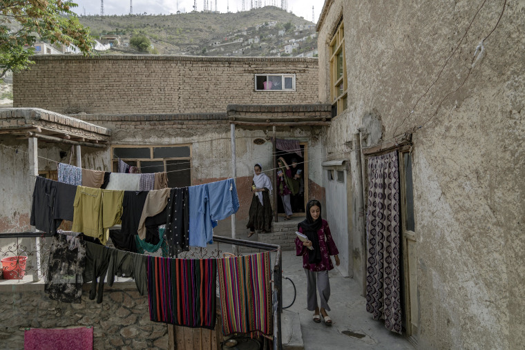 Afghan girls leave an underground school in Kabul last month.
